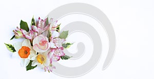 Spring flower arrangement. Pink astromeria, tulips and rose on a white background.