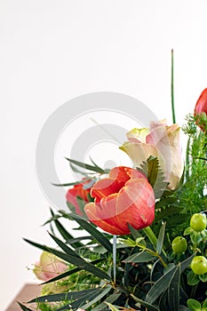 Spring flower bouquet on white background. Colorful vintage flower decoration. Tulips and roses in floreal bouquet