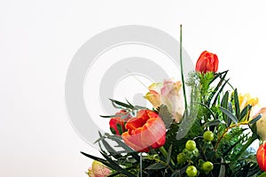 Spring flower bouquet on white background. Colorful vintage flower decoration. Tulips and roses in floreal bouquet