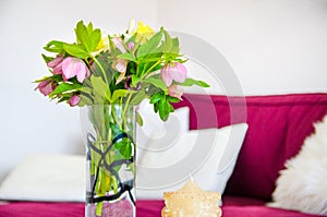 Spring flower and candlestick in the apartment. Beautiful pink flowers. Interior of the house.