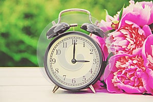 Spring flowers and Alarm Clock. Change the time.