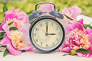 Spring flowers and Alarm Clock. Change the time