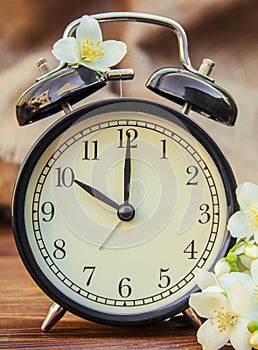 Spring flowers and Alarm Clock. Change the time