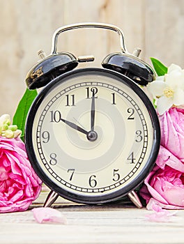 Spring flowers and Alarm Clock. Change the time