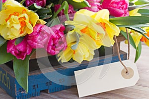 Spring flowers with empty tag