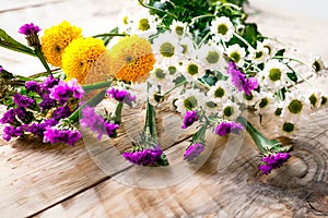 Spring flowers on wooden board