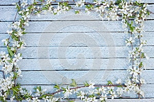 Spring flowers on wooden table background