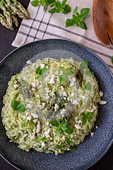 Spring food Delicious risotto with asparagus and wild garlic