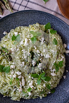 Spring food Delicious risotto with asparagus and wild garlic