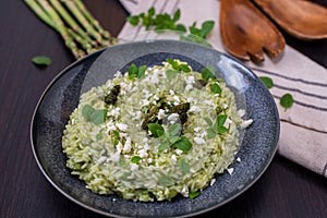 Spring food Delicious risotto with asparagus and wild garlic