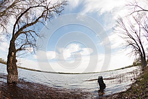Spring forest river landscape. Forest river in springtime. Fallen tree river forest scene