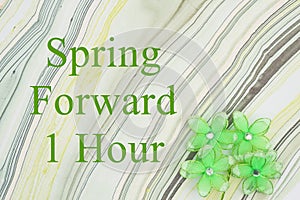 Spring forward 1 hour message with green flowers on watercolor paper