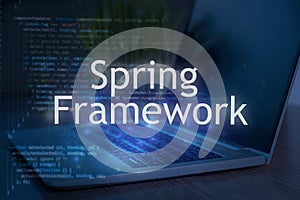 Spring framework inscription against laptop and code background