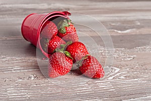 Spring fruits, strawberries in an aluminum bucket