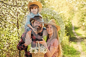 Spring getaway. Happy family enjoy spring nature. Spring break vacation with kid. Blooming trees are hallmark of spring photo