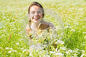 Spring Girl. Beautiful Spring Young Woman Outdoors Enjoying Nature. Smiling Young Woman in Green Grass. Spring Meadow