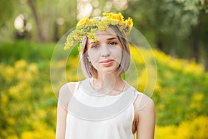 Spring girl in blossom park outdoor. Beautiful young woman portrait