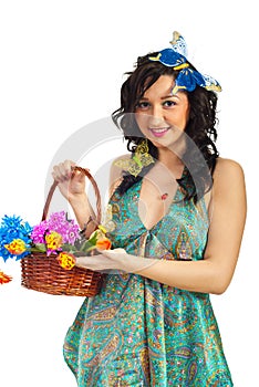 Spring girl showing basket with flowers
