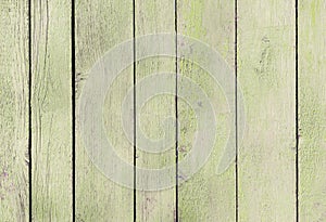 Spring Green Craiola old wooden fence. wood palisade background. planks texture, weathered surface