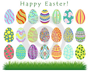 Spring holiday collection with Happy Easter eggs with different textures and patterns and grass
