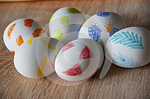 Spring holiday at Sunday. Eastertide and Eastertime. Good Friday. Hunting eggs. Painted eggs. Easter eggs on wooden table. Happy photo