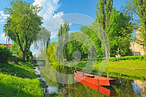 Spring landscape with boat on the Narew river.