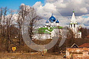 Spring landscape with chirches and trees