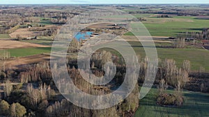 Spring landscape with groves and crop fields, aerial