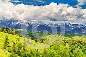 Spring landscape with snowy mountains near Brasov, Transylvania, Romania, Europe