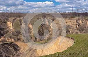 Spring landscape with soil erosion and natural ravines in Ukraine