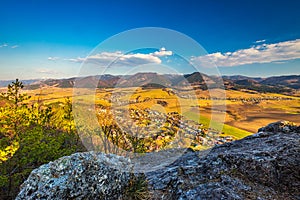 Spring landscape with valley and mountains in background