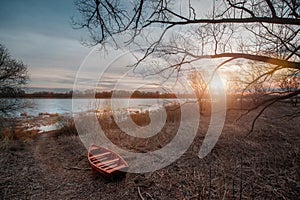 Spring landscape with wooden boat