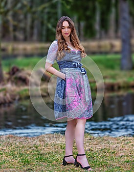 Spring magic in a dirndl: Woman enjoying nature in a meadow
