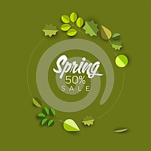 Spring minimalist sale label with leaves on green background