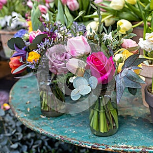 Spring modest bridal bouquet with red rose, eucalyptus, tulip,