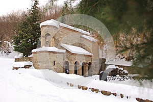 The spring in Monastery of St. Nino at Bodbe in winter photo