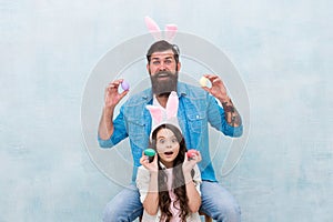 Spring mood. easter family party. happy easter concept. father and daughter collect pained eggs. egg hunt is right now