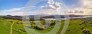 Spring mountain panorama. Lake Czorsztyn on Dunajec river. Village in green forest and meadow hills