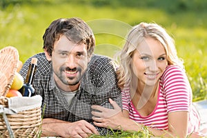 Spring picnic. Loving young couple enjoying a romantic picnic in