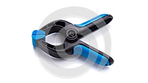 Spring plastic clamp on white background