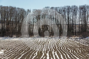 Spring Plowed Field Partly Covered Winter Melting Snow Ready For New Season