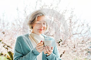 Spring portrait of beautiful and elegant middle age woman