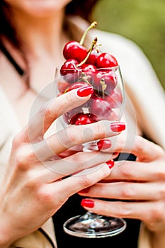 Spring portrait of a girl. first fruits. cherries, flowers, beauty, nature