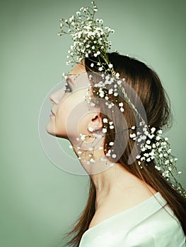 Spring portrait girl with wreath of flowers