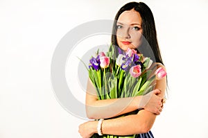 Spring portrait of a woman with bouquet of tulips