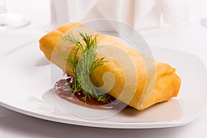 Spring Roll Elegantly Complimented with Dill and Served on Sweet