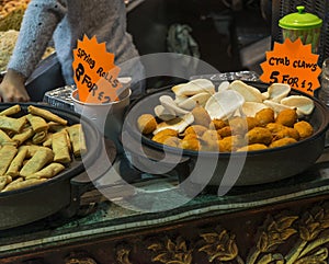 Spring rolls and crab claws exposed in Camden Town