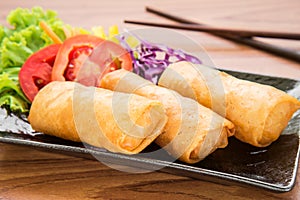 Spring rolls on dish