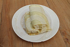 Spring rolls on a white ceramic plate