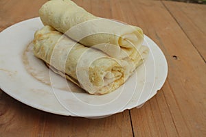 Spring rolls on a white ceramic plate